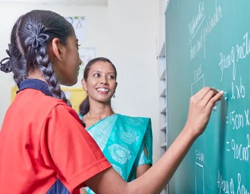 Children laughing together in outdoor play area